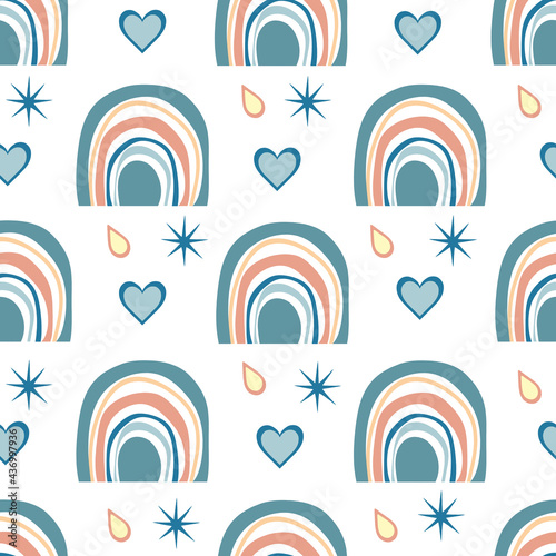 Seamless pattern of cute rainbows in boho style. Hand drawn Scandinavian rainbows and drops with hearts on a white background. For the design of nursery wallpaper, printing on fabric.