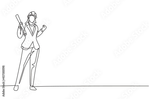 Single one line drawing female architect stood with celebrate gesture and wearing helmet carrying blueprint for the building's work plan. Modern continuous line draw design graphic vector illustration