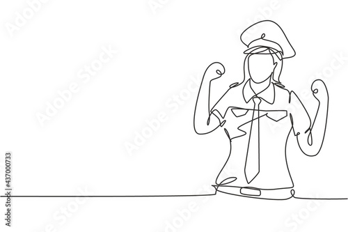 Single continuous line drawing female pilot with celebrate gesture and full uniform ready to fly with cabin crew in aircraft at international airport. One line draw graphic design vector illustration