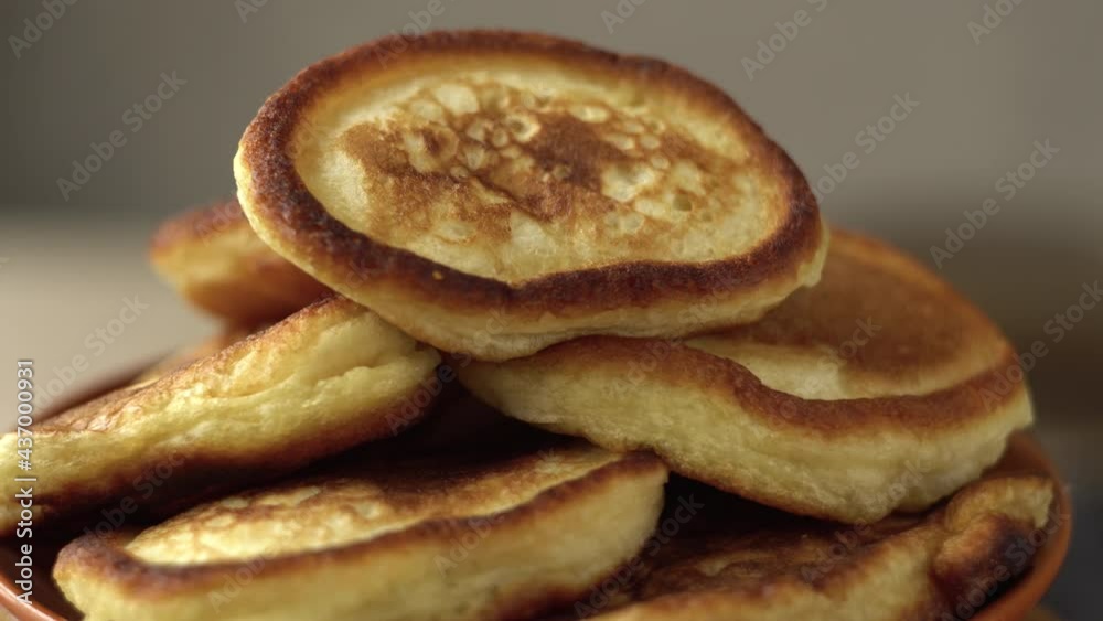 Cooked pancakes. Fried pancakes. Tasty breakfast. National dish. Afternoon tea with tea. Object tilt. Close-up. Cooked pancakes. Fried pancakes. Tasty breakfast. National dish. Afternoon tea with tea. Object tilt. Close-up.