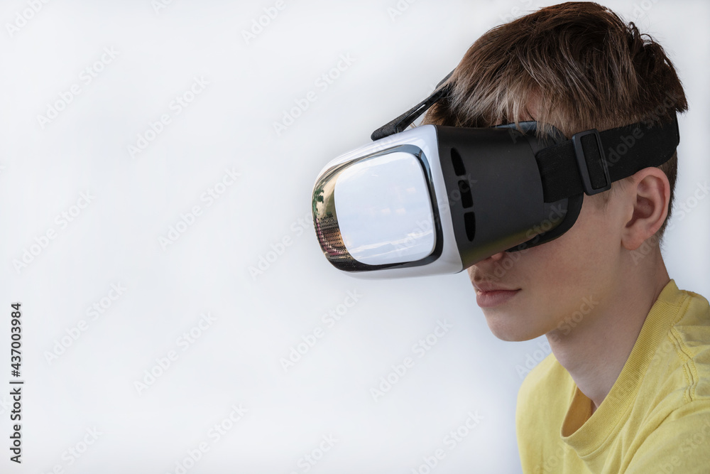 Portrait of a young man wearing virtual reality glasses. The concept of technology, science, innovation, and cyberspace. Copy space Portrait of a young man wearing virtual reality glasses. The concept of technology, science, innovation, and cyberspace. Copy space