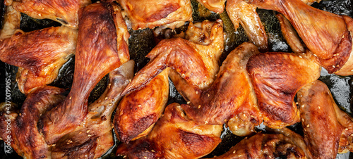 Baked oven chicken wings and legs. Food recipe background. Close up