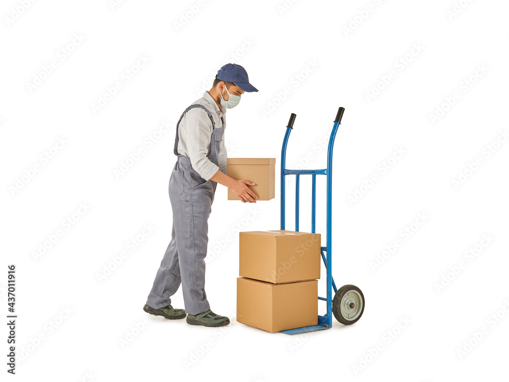Delivery man pushing and pointing out hand truck, trolley isolated on white background. Delivery man pushing and pointing out hand truck, trolley isolated on white background.