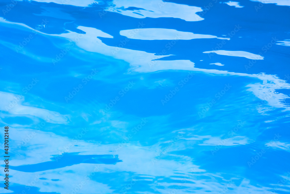 blue water background of a swimming pool 