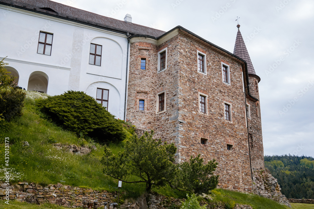Gothic medieval castle Velhartice in sunny day, tower and facade with arches, fortress masonry wall, old stronghold, Velhartice, National Park Sumava, South Bohemia, Czech Republic Gothic medieval castle Velhartice in sunny day, tower and facade with arches, fortress masonry wall, old stronghold, Velhartice, National Park Sumava, South Bohemia, Czech Republic