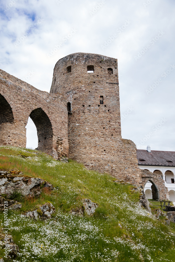 Gothic medieval castle Velhartice in sunny day, tower and stone arch bridge, fortress masonry wall, old stronghold, Velhartice, National Park Sumava, South Bohemia, Czech Republic