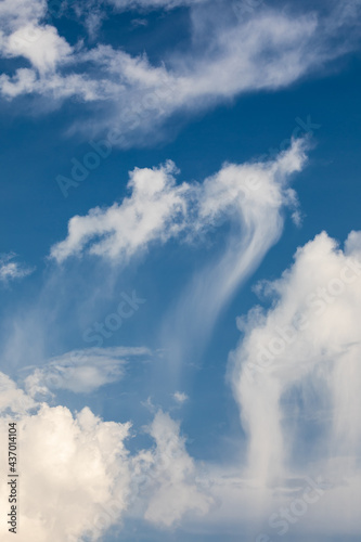 Abstract scene of melting clouds with blue sky.