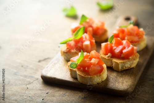 Traditional homemade bruschetta with tomato and basil 
