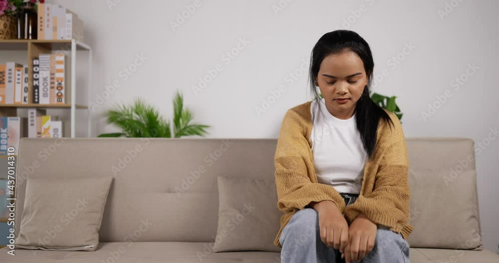 Girl headache while sit on sofa Girl headache while sit on sofa