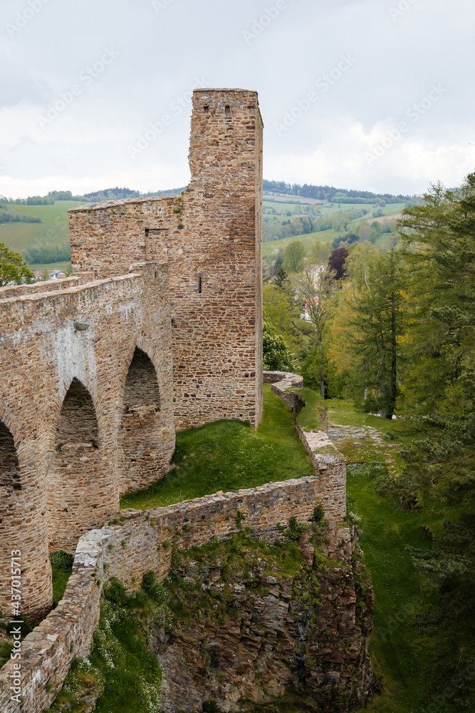 Gothic medieval castle Velhartice in sunny day, tower and stone arch bridge, fortress masonry wall, old stronghold, Velhartice, National Park Sumava, South Bohemia, Czech Republic