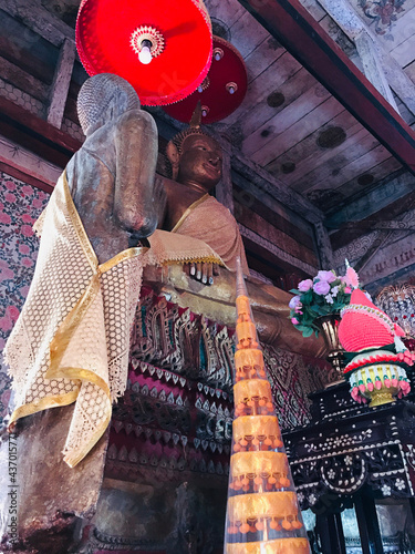 Trat, Thailand - December 20, 2020:  Buddha image in the ubosot of Buppharam temple (Wat Buppharam or Wat Plai Khlong) in Trat, Thailand. photo