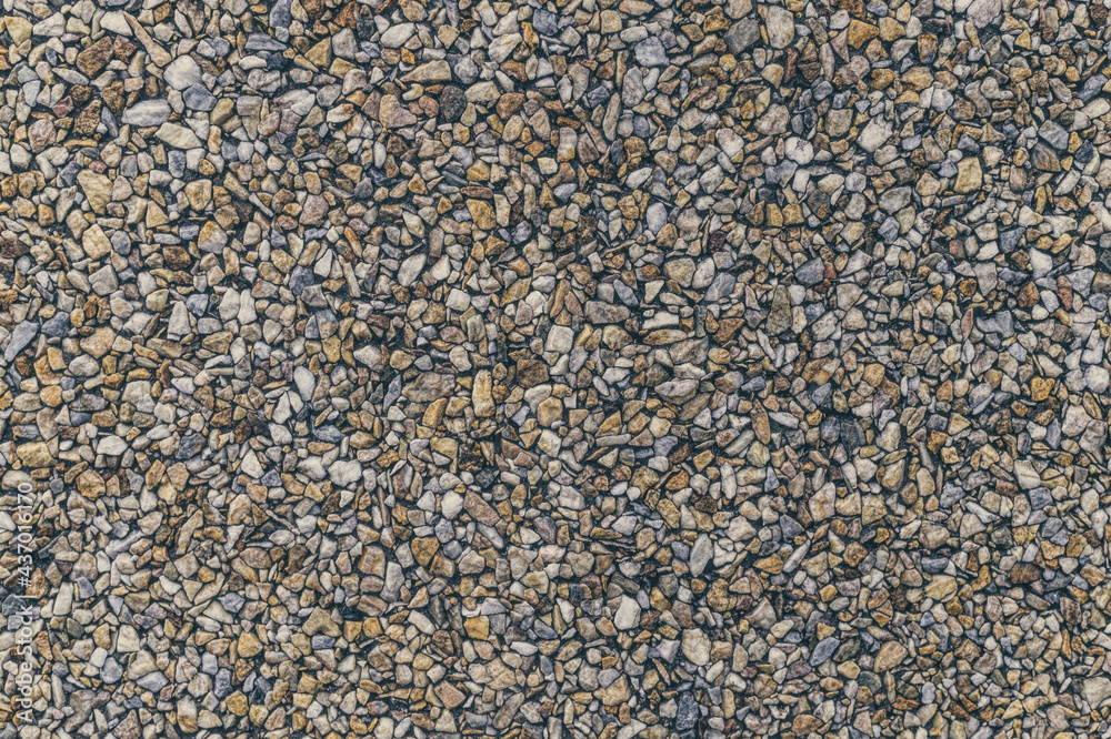 Textured sidewalk with gravel stone Textured sidewalk with gravel stone
