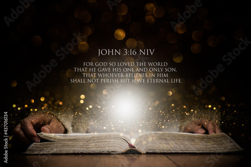 A woman holding bible with a bible verse