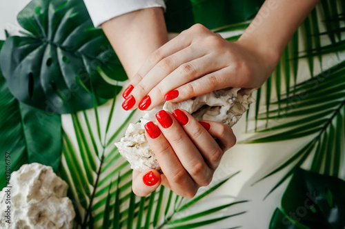 Φωτογραφία Manicured woman's nails with red nail polish.