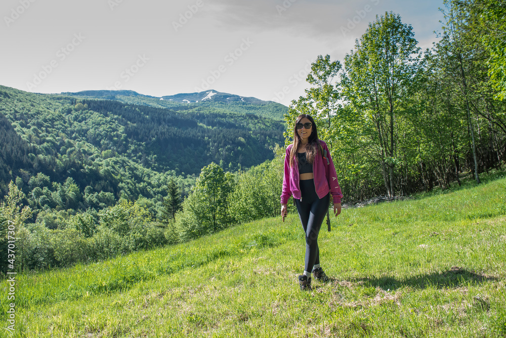 woman walking in the woods