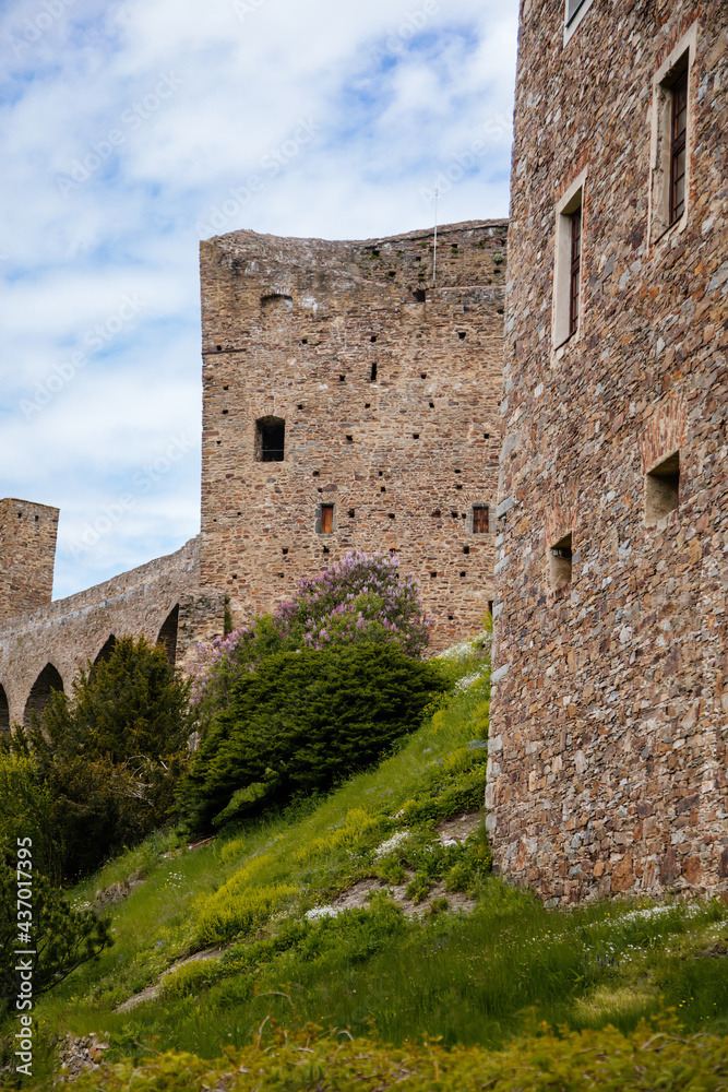 Gothic medieval castle Velhartice in sunny day, tower and stone arch bridge, fortress masonry wall, old stronghold, Velhartice, National Park Sumava, South Bohemia, Czech Republic