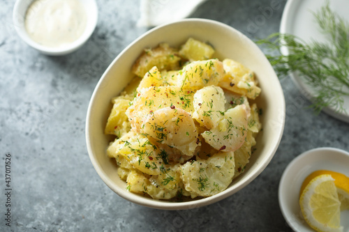 Traditional homemade potato salad with herbs photo