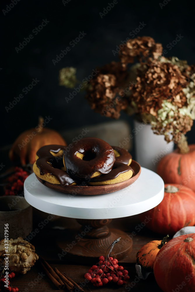 Pumpkin donuts with nutella glaze.