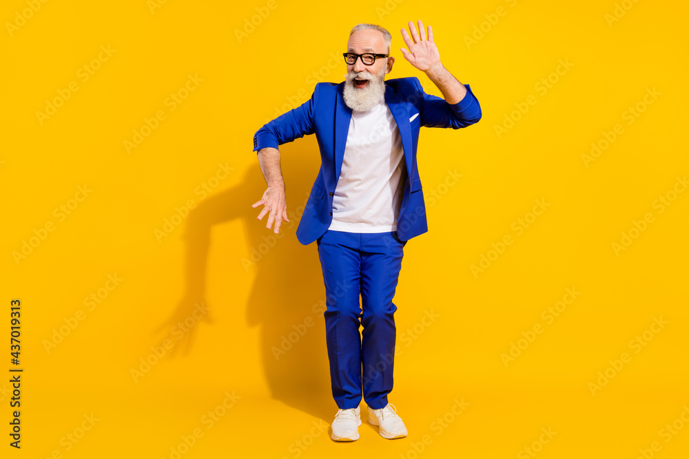 Full size photo of funny grey beard aged man dance wear spectacles blue jacket isolated on yellow background