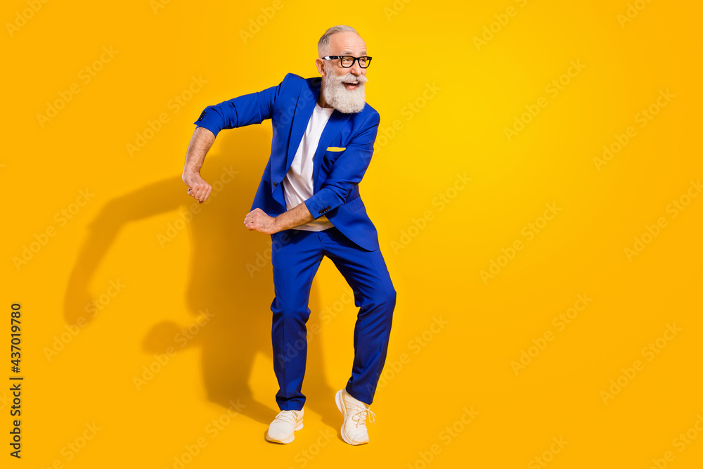 Full body photo of cheerful dreamy happy old man dance look empty space isolated on shin yellow color background Full body photo of cheerful dreamy happy old man dance look empty space isolated on shin yellow color background