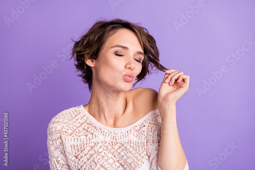 Photo of pretty charming young woman wear knitted shirt arm holding curl lips pouted closed eyes isolated violet color background