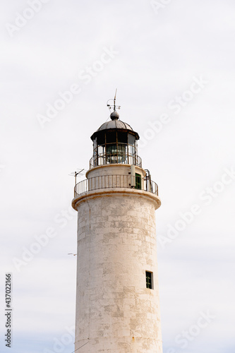 closeup of a lighthouse with white background