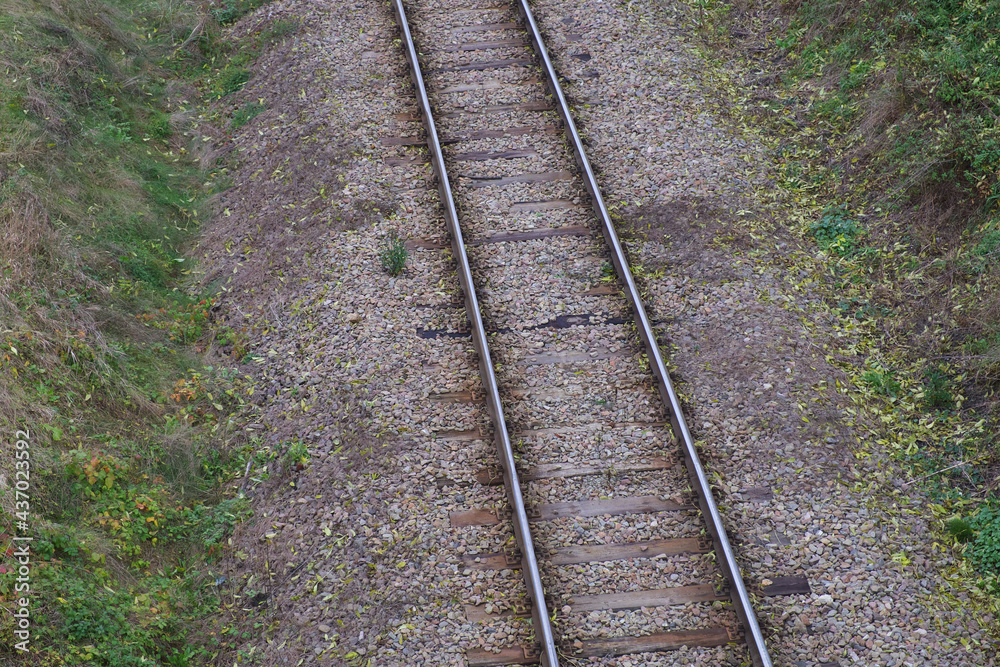 Railway bed. Fragment of railway tracks, top view, rails and sleepers. Railway bed. Fragment of railway tracks, top view, rails and sleepers.