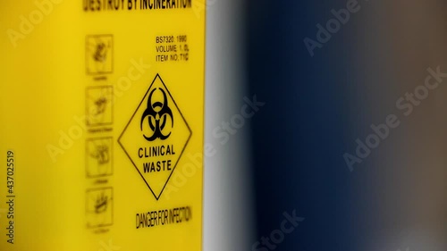 Real yellow tank with warning labels. Clinical waste, danger for infection. Footage for ecology disaster and radiation. Reservoir filled with danger toxic waste. Yellow container