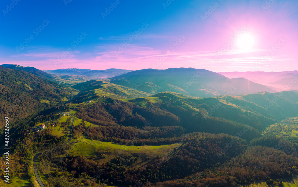 View of the tops of mountain ridge during sunset