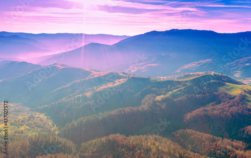 View of the tops of mountain ridge during sunset