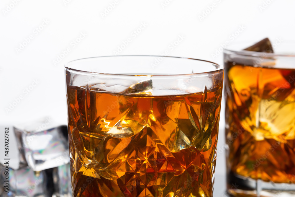 Whiskey in old fashioned glasses with ice, close up Whiskey in old fashioned glasses with ice, close up