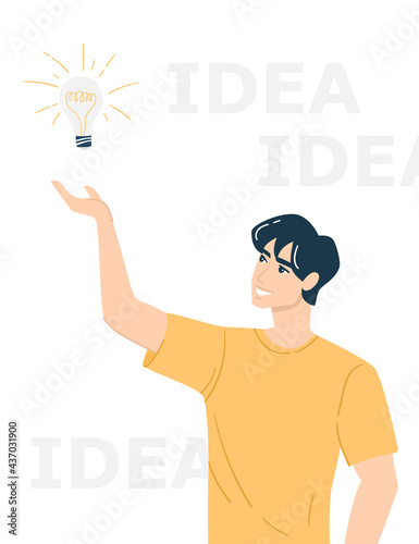 Gesture "have an idea". The young man had an idea. A man holds a lamp as a symbol of a new idea.