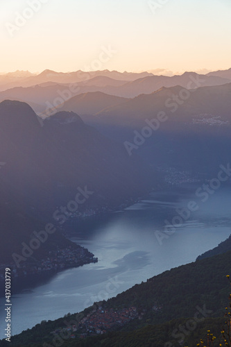 Fototapeta Naklejka Na Ścianę i Meble -  The mountains of Lake Como with sunset colors during spring, near the city of Como, Italy - May 2021