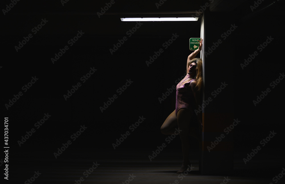Androgynous man in dress and high heels Androgynous man in dress and high heels