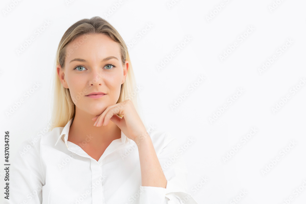 Beautiful young Caucasian businesswoman with blue eyes looking at camera with white background. Beautiful young Caucasian businesswoman with blue eyes looking at camera with white background.