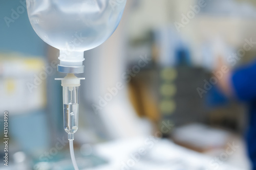 Set vitamin iv fluid intravenous drop saline drip hospital room Medical Concept treatment emergency and injection drug infusion care chemotherapy concept.blue light background selective focus