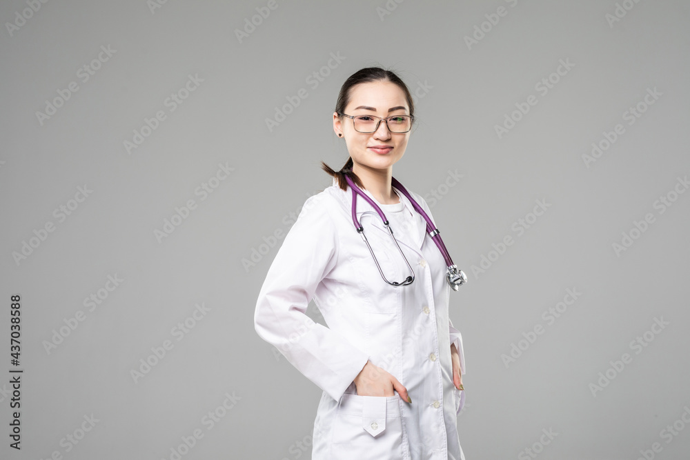 Young asian doctor woman isolated on gray background Young asian doctor woman isolated on gray background
