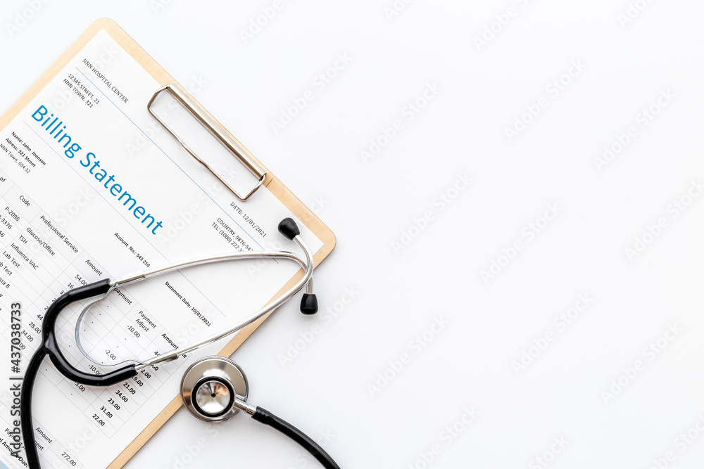 Medical billing statement with stethoscope. Top view Medical billing statement with stethoscope. Top view