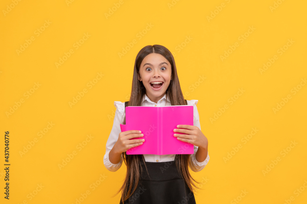 surprised teen girl in school uniform reading book, amasement surprised teen girl in school uniform reading book, amasement