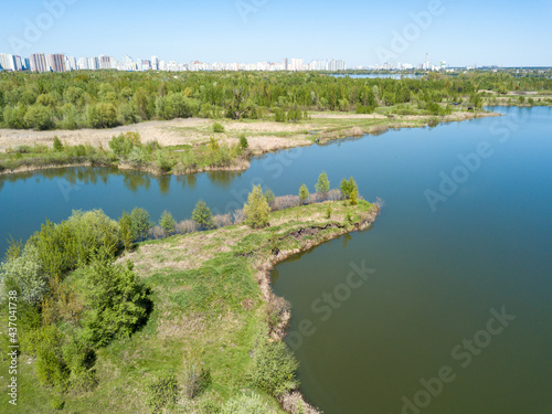 Lake shore in spring. Aerial drone view.