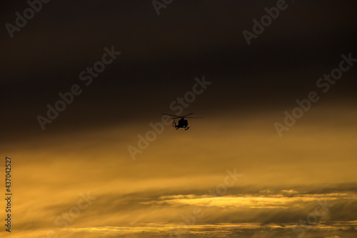 A helicopter coming from its flight during dusk © JANAM