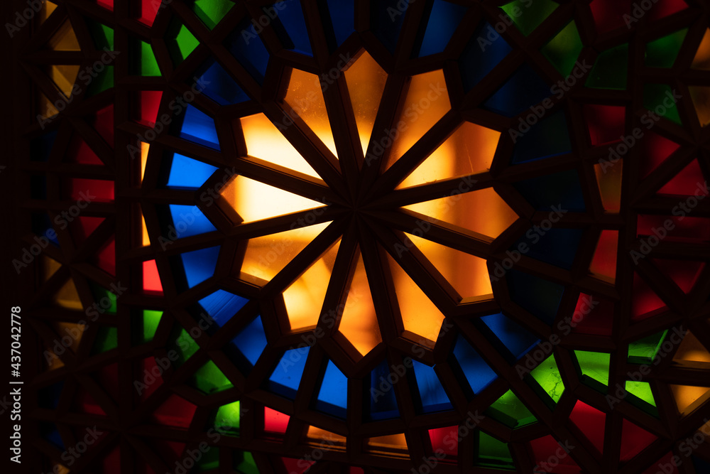 Photo of colored stained glass with colored light