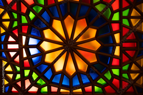 Photo of colored stained glass with colored light