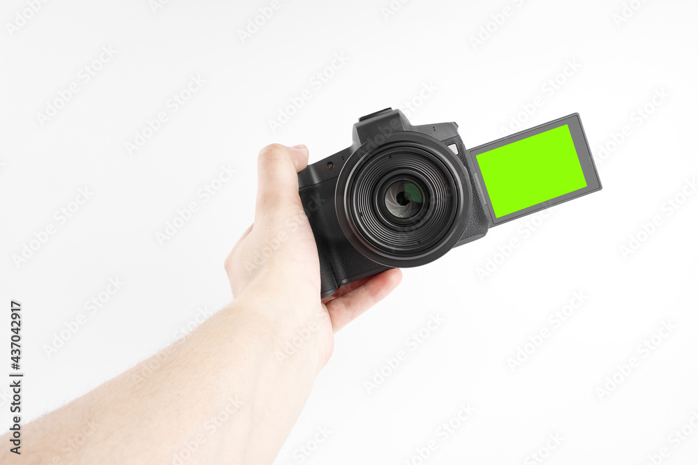 Photo video camera isolated on a white background. Camera for selfies and vlogging. Professional equipment for the photographer.