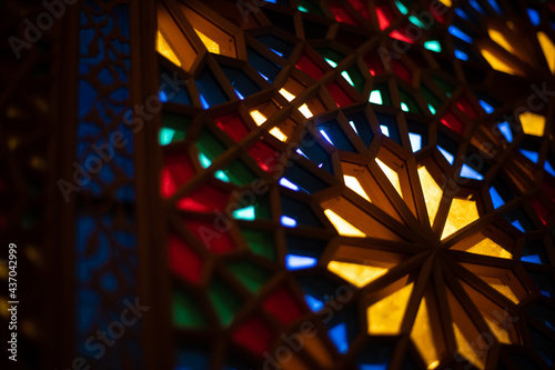 Photo of colored stained glass with colored light