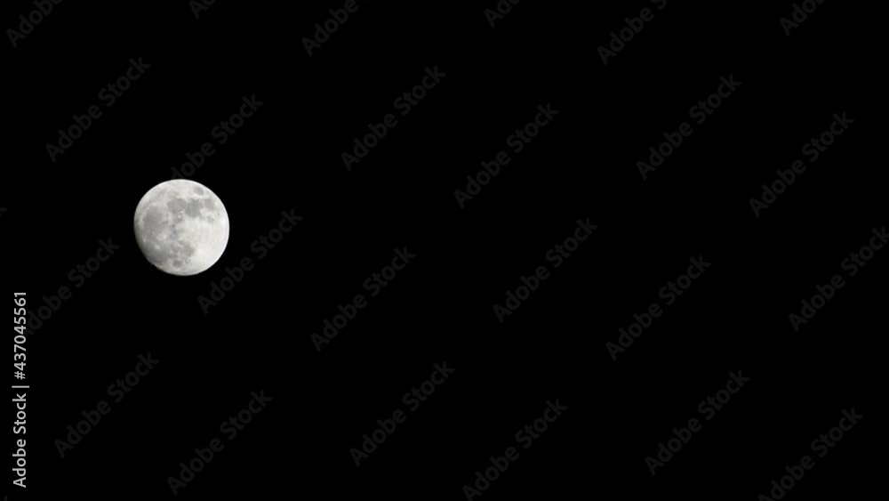 Moon Timelapse, Stock time lapse : Full moon rise in dark nature sky, night time. Full moon disk time lapse with moon light up in night dark black sky. High-quality free video footage or timelapse