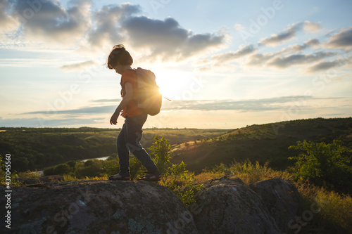 boy with a backpack on a hike