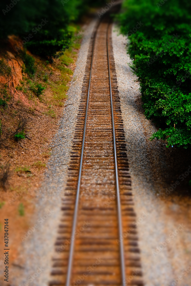 Railroad tracks with tilt shift lens effect Railroad tracks with tilt shift lens effect