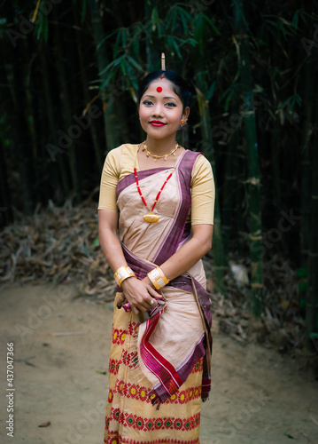 girl smiling face isolated dressed in traditional wearing on festival with blurred background photo