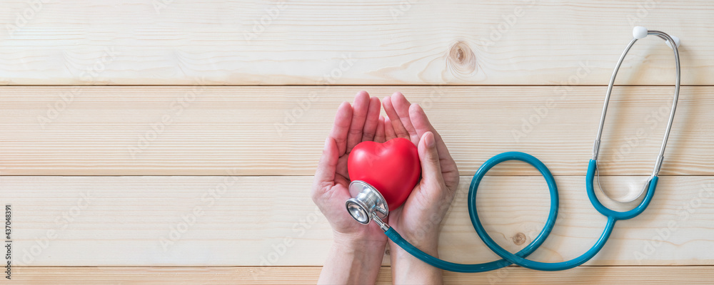 Φωτογραφία World heart health day concept with red heart and medical doctor stethoscope on